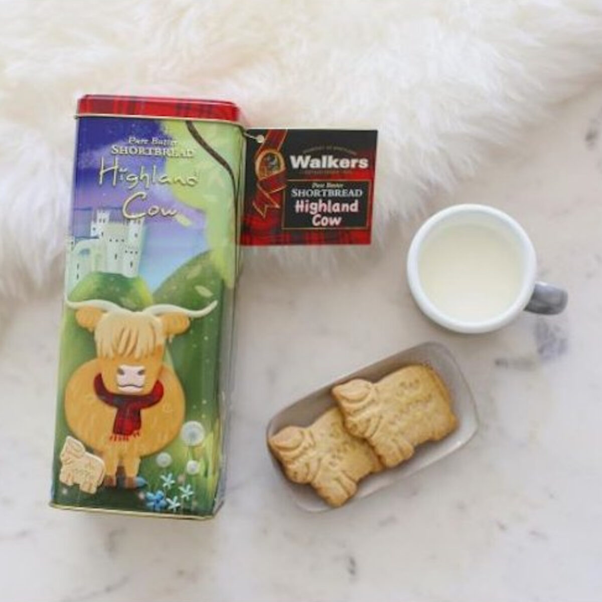 Walkers Shortbread Highland Cow Keepsake Tin featuring buttery Scottish shortbread and a charming Highland cow design