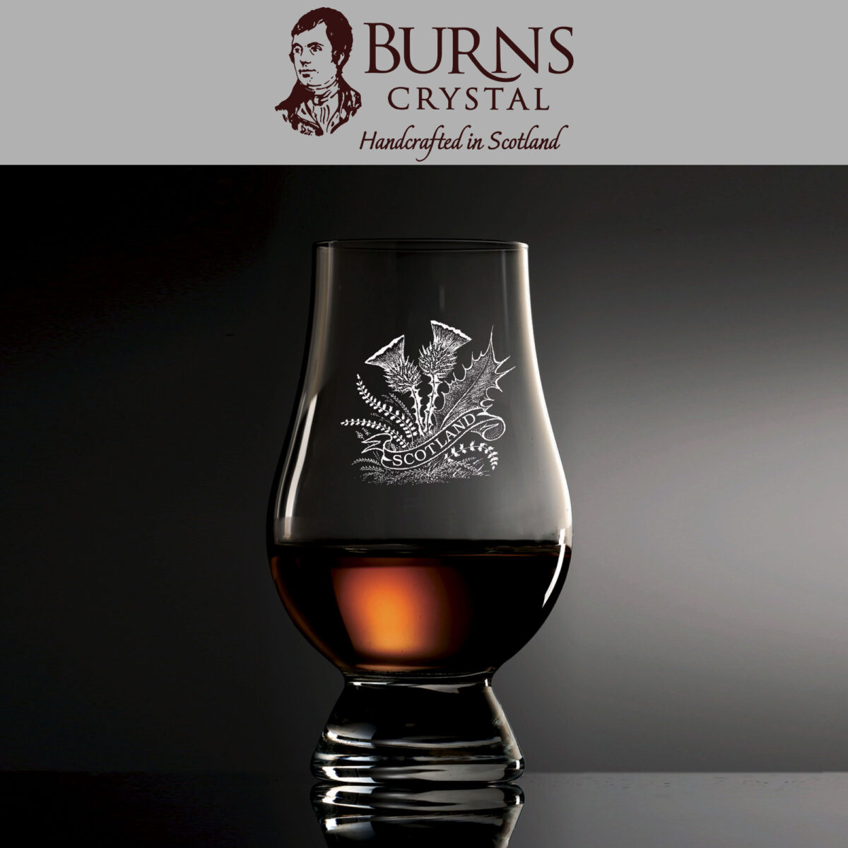 The Burns Crystal Glencairn Glass with two thistles and "Scotland" ribbon