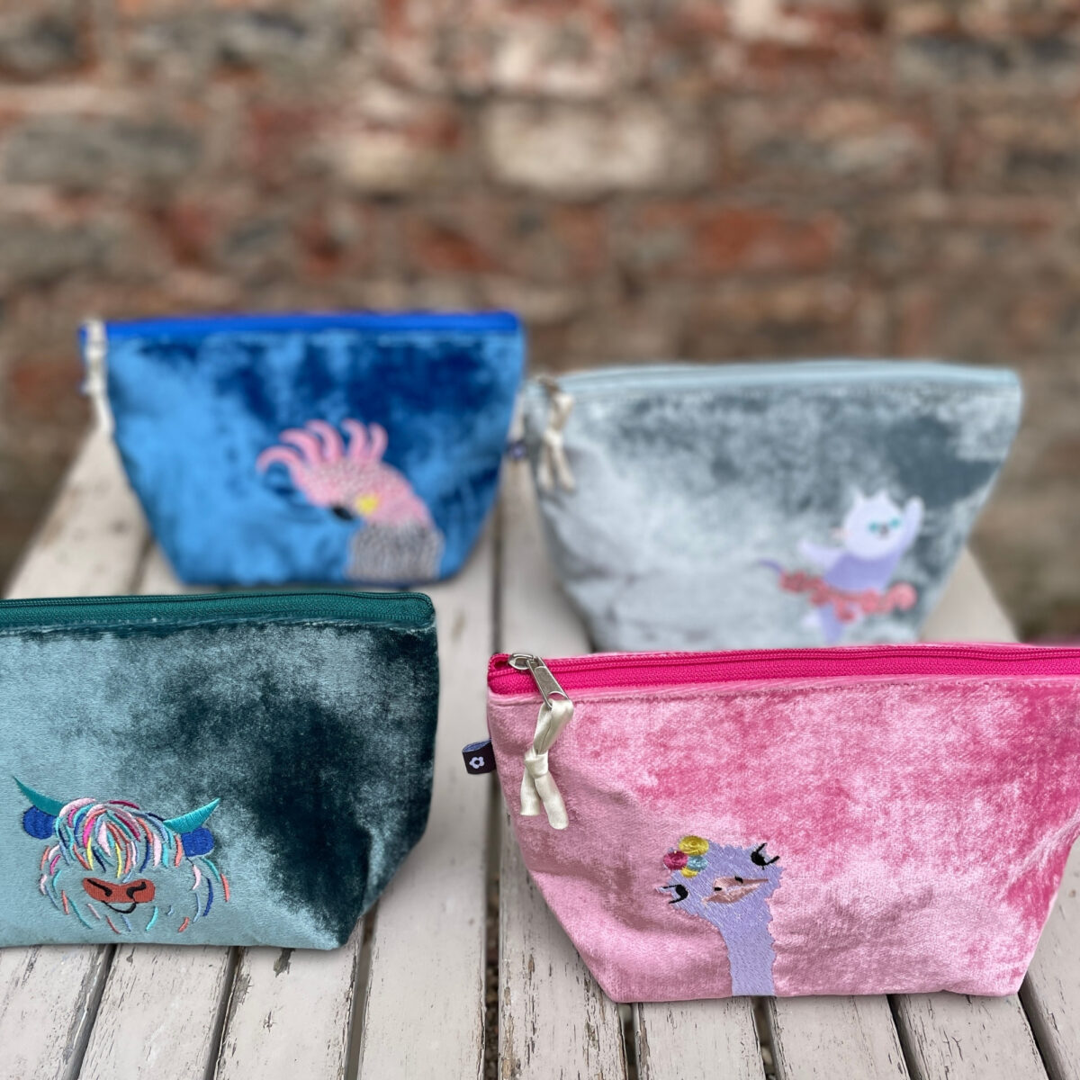 Silk Velvet Makeup Bag in luxurious fabric with embroidered designs, featuring a splashproof lining