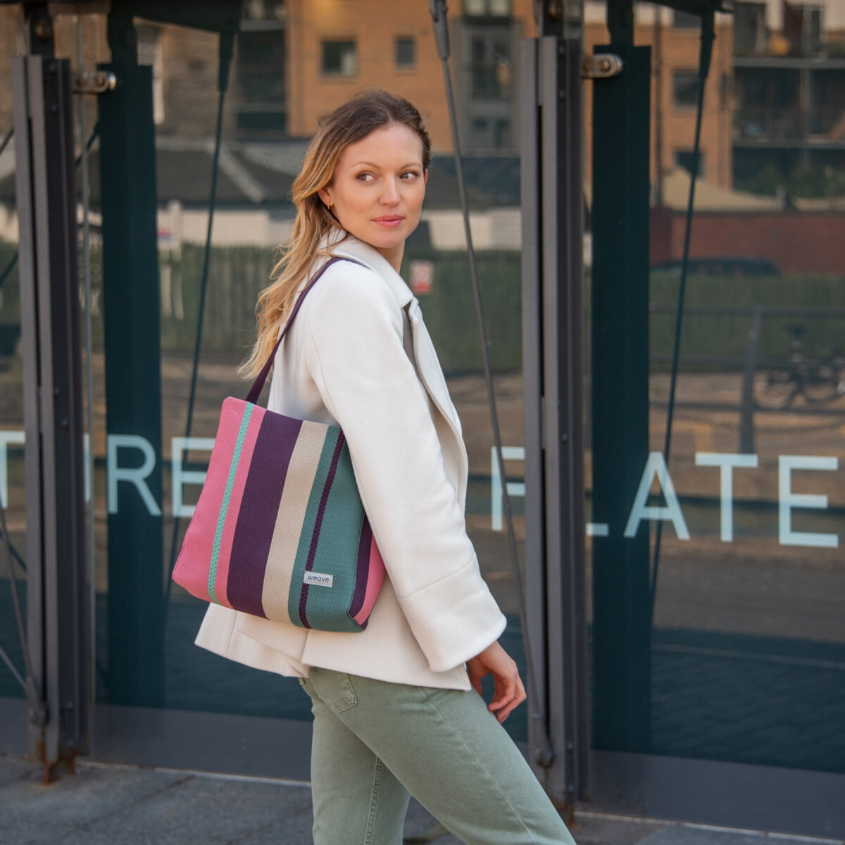 Weave Stripe Messenger Bag with textured design, made from recycled ocean plastic waste