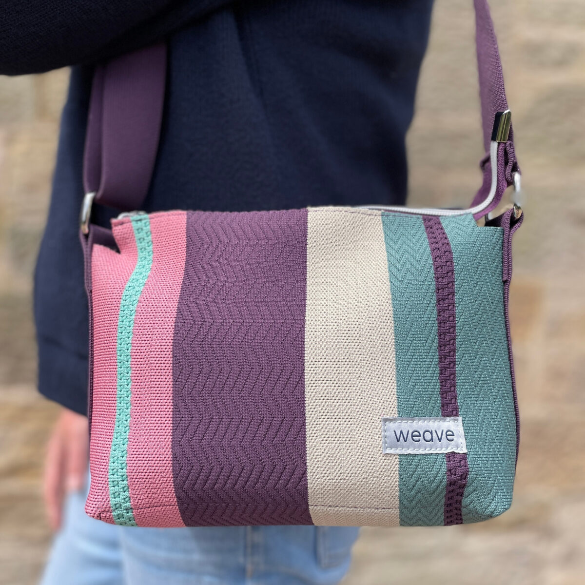 Weave Stripe Messenger Bag with textured design, made from recycled ocean plastic waste