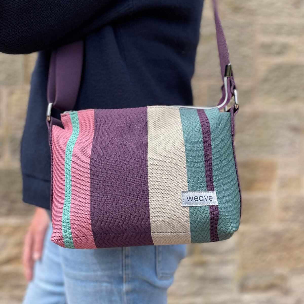 Weave Stripe Messenger Bag with textured design, made from recycled ocean plastic waste