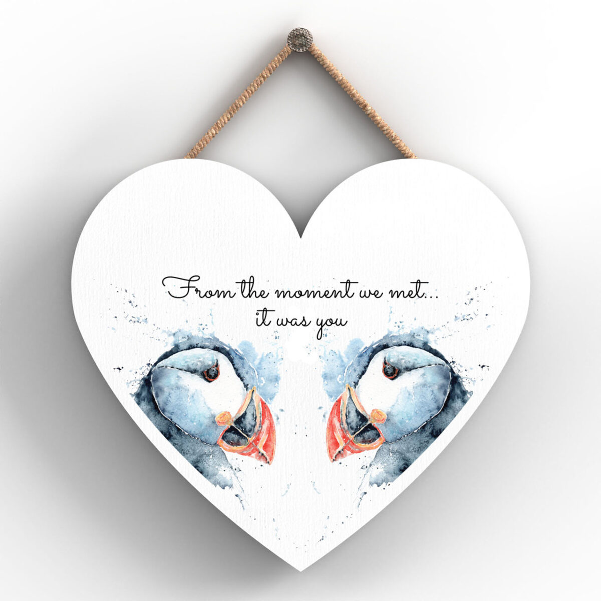 Heart-shaped wooden plaque with two puffins and “From the moment we met... it was you” message