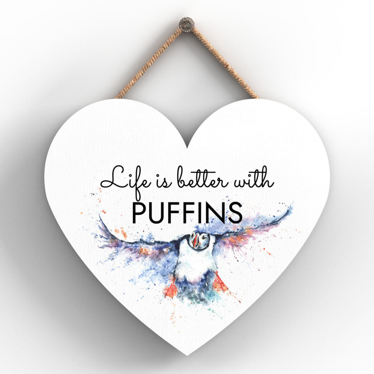 Heart-shaped wooden plaque with puffin in flight and “Life is better with PUFFINS” message